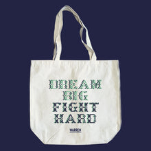 Load image into Gallery viewer, Natural canvas tots featuring a cross stitch style print of the phrase, Dream Big, Fight Hard. (4407646486637) (7431626621117)