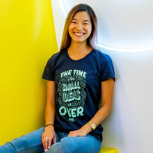 Load image into Gallery viewer, Warren staff wearing the navy &quot;The Time For Small Ideas Is Over&quot; shirt.  (4042752065645) (7433024602301)
