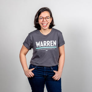 Warren Minimalist Unisex Asphalt T-shirt with White and Liberty green text. On smiling model with hands in pockets. (1519734849645) (7433026207933)