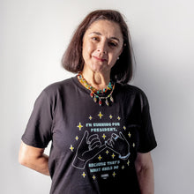 Load image into Gallery viewer, Woman standing and wearing a Pink Promise Unisex T-Shirt in Black with her hand behind her back. (4170169516141) (7432140357821)