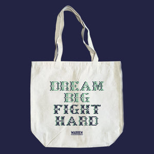Natural canvas tots featuring a cross stitch style print of the phrase, Dream Big, Fight Hard. (4407646486637) (7431626621117)
