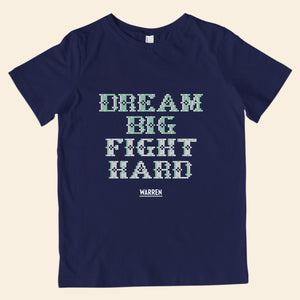 Navy youth t-shirt featuring cross stitch style print of the phrase, Dream Big, Fight Hard. (4407626924141) (7431627014333)