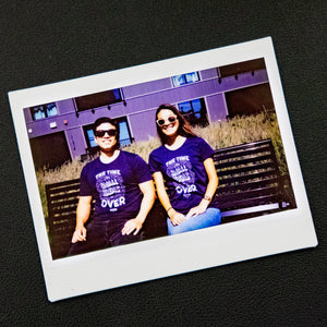 A Polaroid photo of two Warren staff wearing the The Time For Small Ideas Is Over shirt.   (4042752065645) (7433024602301)
