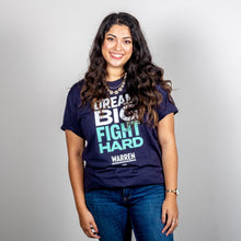 Load image into Gallery viewer, Dream Big, Fight Hard Unisex Navy T-shirt with White and Liberty Green Text. On smiling model. (1518922596461) (7432137736381)