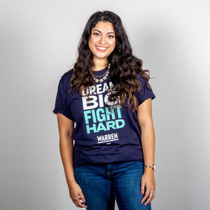 Dream Big, Fight Hard Unisex Navy T-shirt with White and Liberty Green Text. On smiling model. (1518922596461) (7432137736381)