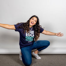 Load image into Gallery viewer, Dream Big, Fight Hard Unisex Navy T-shirt with White and Liberty Green Text. On model kneeling with open arms. (1518922596461) (7432137736381)